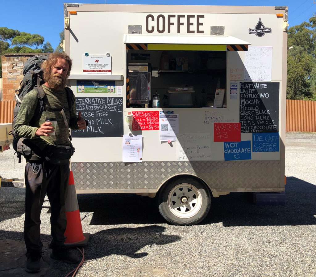 Paul walking on Lavender Federation Trail enjoys break at the Coffee Cubicle outside Manoora Memorial Hall